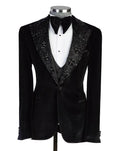 Black tuxedo with decorative lapels on a mannequin against a white background