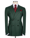 A dark green double-breasted suit jacket displayed on a mannequin torso, styled with a white dress shirt, a red patterned tie, and a matching red pocket square against a plain white background.