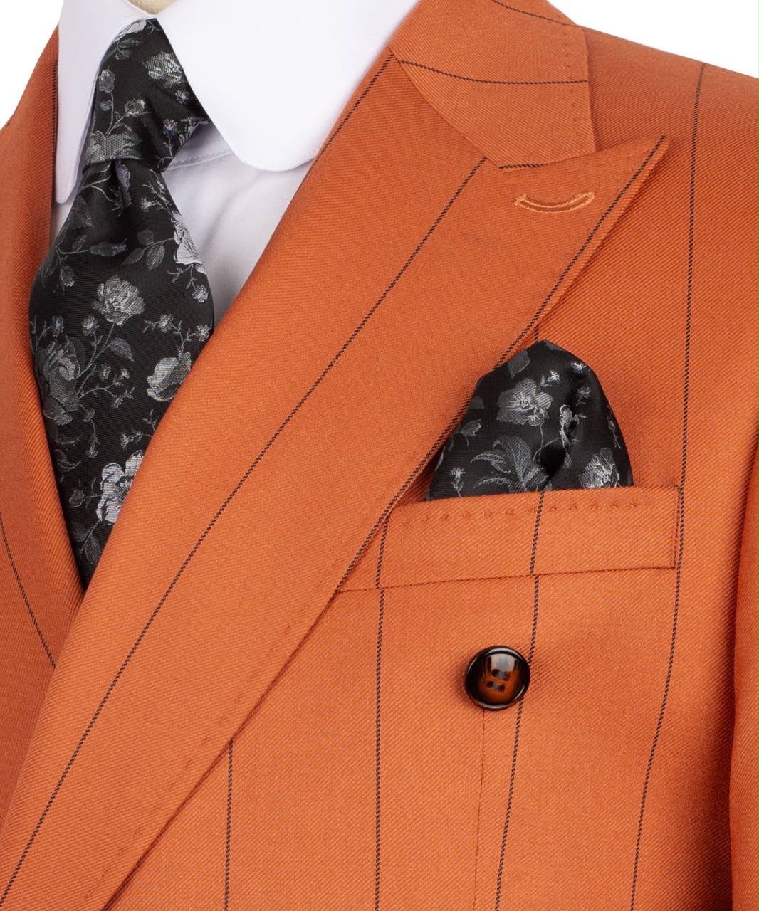 Close-up of an orange pinstripe suit with a black floral tie and pocket square.