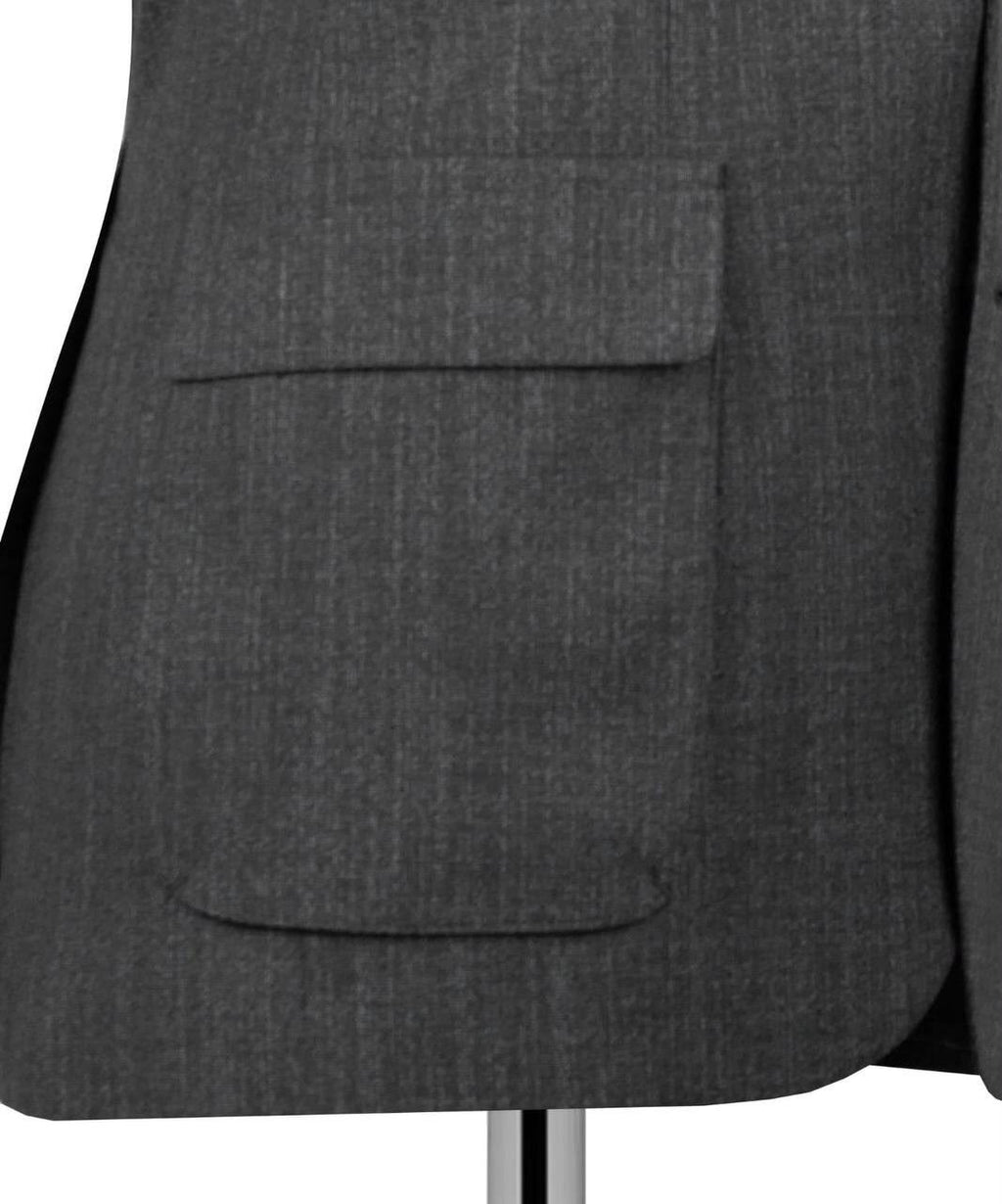 Close-up of a navy blue textured blazer jacket with a single front flap pocket, displayed on a mannequin torso against a white background.