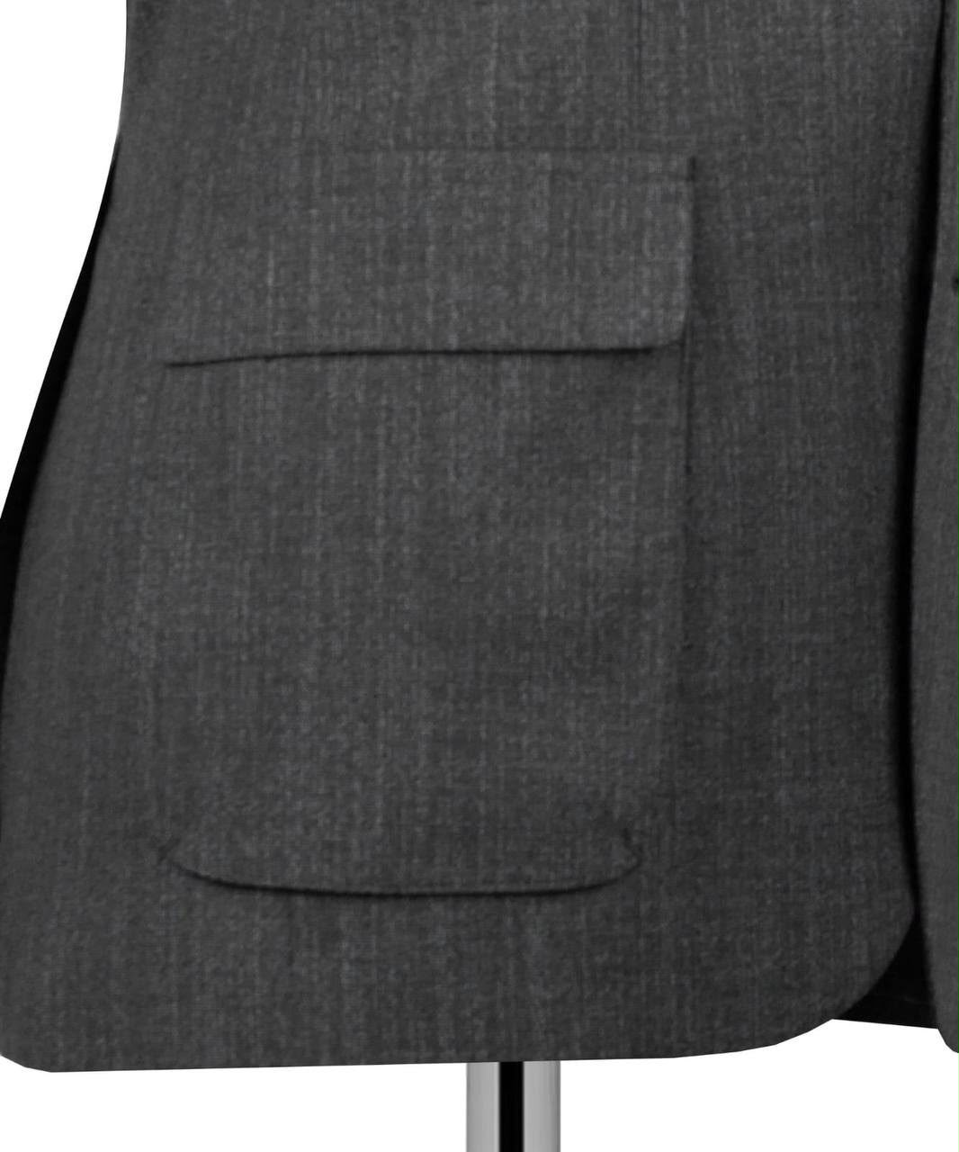 Close-up of a navy blue textured blazer jacket with a single front flap pocket, displayed on a mannequin torso against a white background.