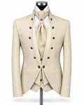A men's formal suit displayed on a mannequin, featuring a cream-colored jacquard patterned jacket with double-breasted dark buttons, a matching waistcoat, a light beige tie, and a white shirt.