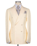 A pale cream double-breasted suit jacket displayed on a mannequin torso, styled with a light blue patterned dress shirt, a matching paisley tie, and a pocket square, set against a plain white background.