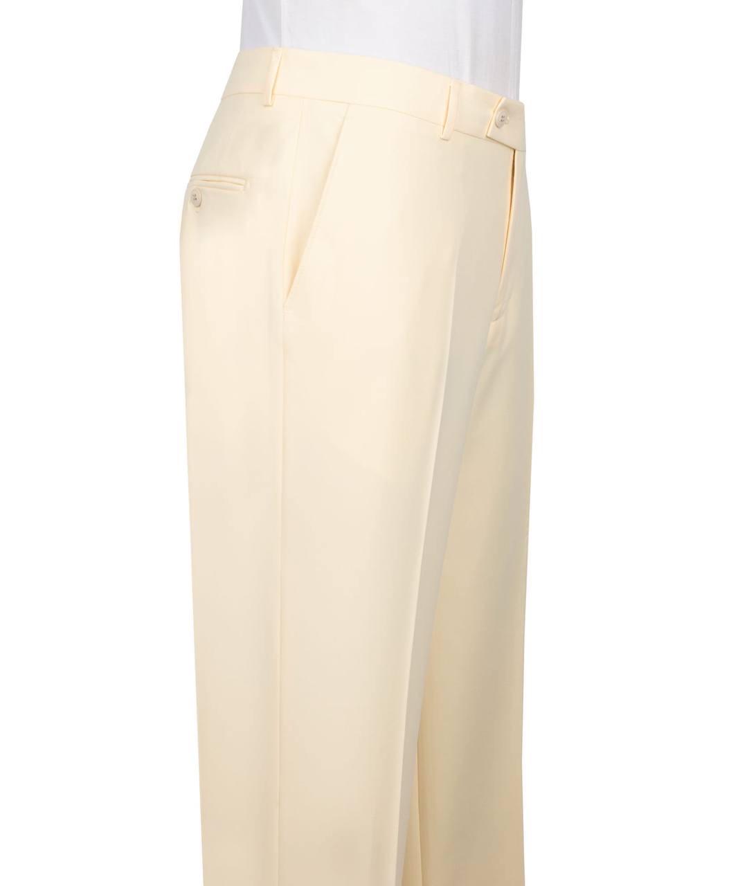 A close-up side view of a person wearing light cream or ivory trousers, showing the side pocket, waistband, belt loops, and front crease, against a plain white background.