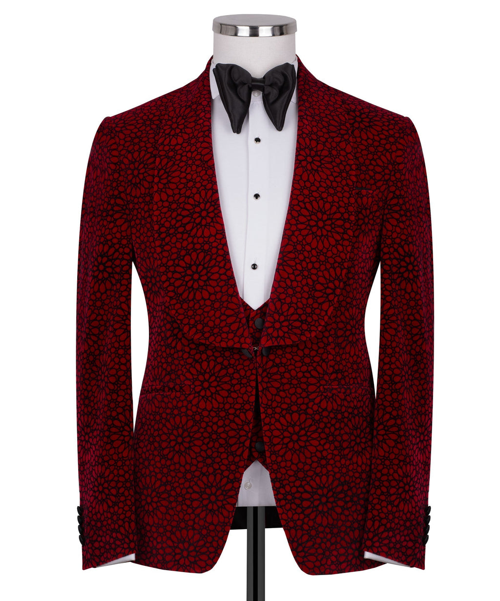 Front view of red patterned tuxedo jacket with black bow tie and buttoned white waistcoat