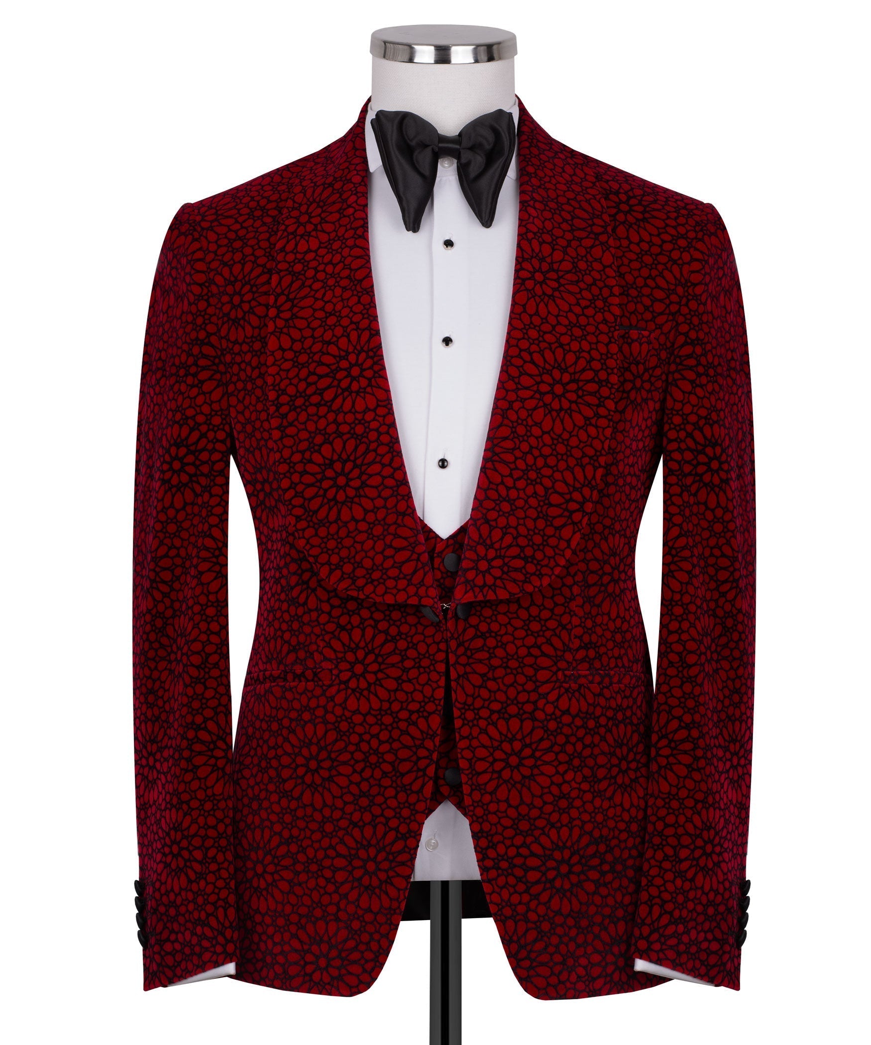 Front view of red patterned tuxedo jacket with black bow tie and buttoned white waistcoat