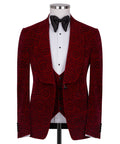 Red patterned tuxedo jacket with black satin bow tie over white vest and shirt