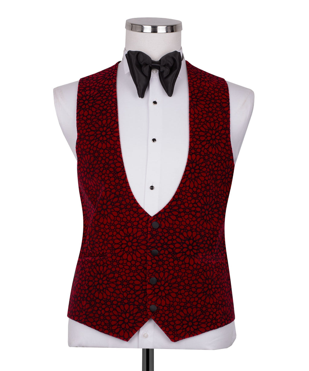 Red patterned tuxedo vest and jacket front with black bow tie and white dress shirt