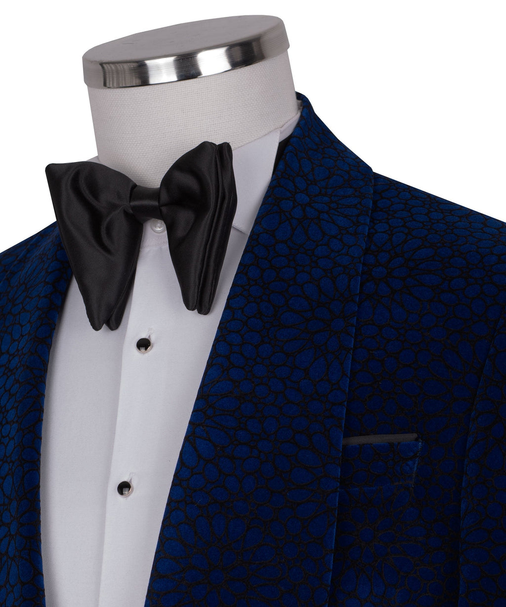 Blue velvet lapel close-up with black bow tie and breast pocket