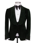 Green velvet tuxedo jacket with black vest and black bow tie, tailored formal look
