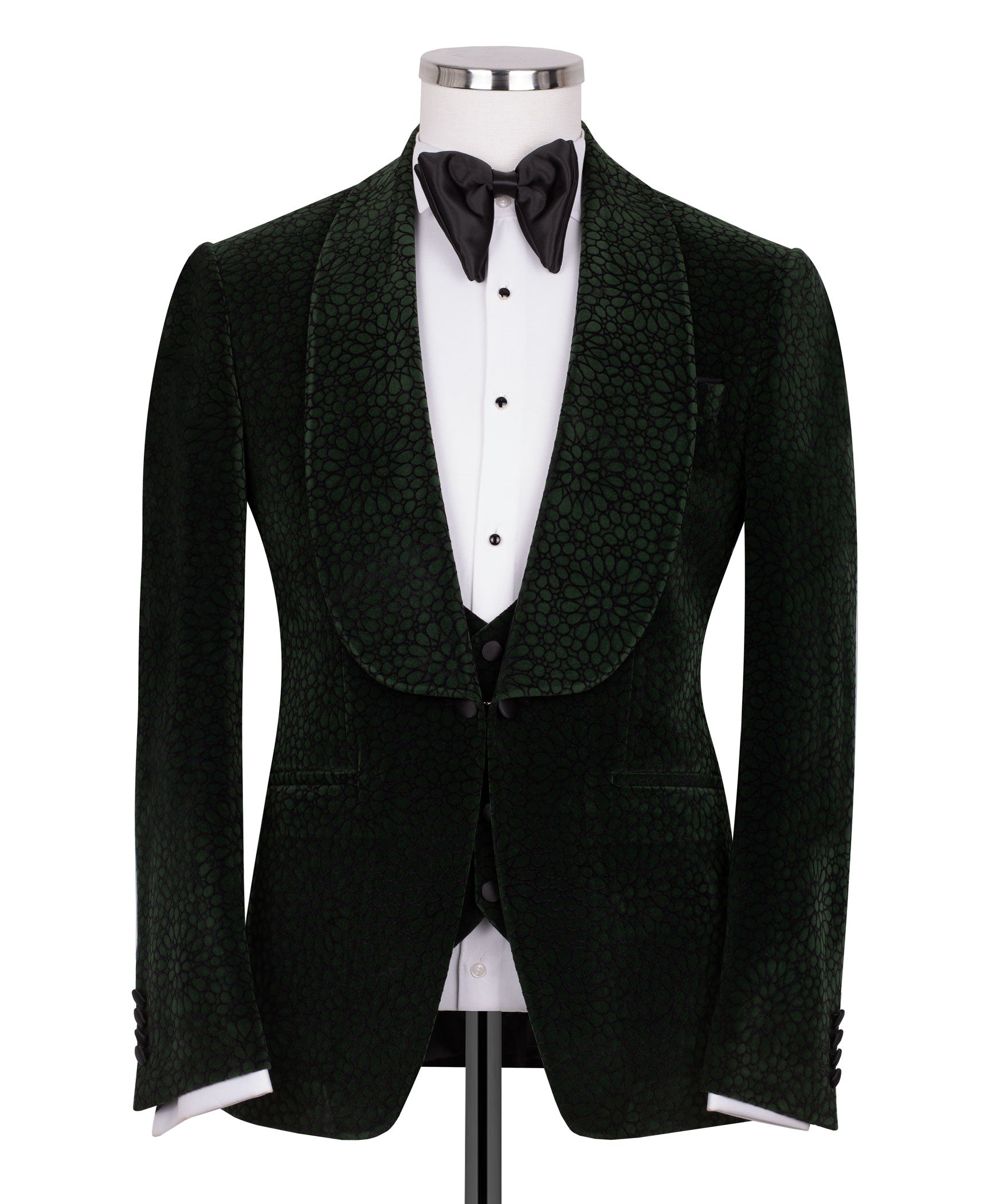 Green velvet tuxedo jacket with black vest and black bow tie, tailored formal look