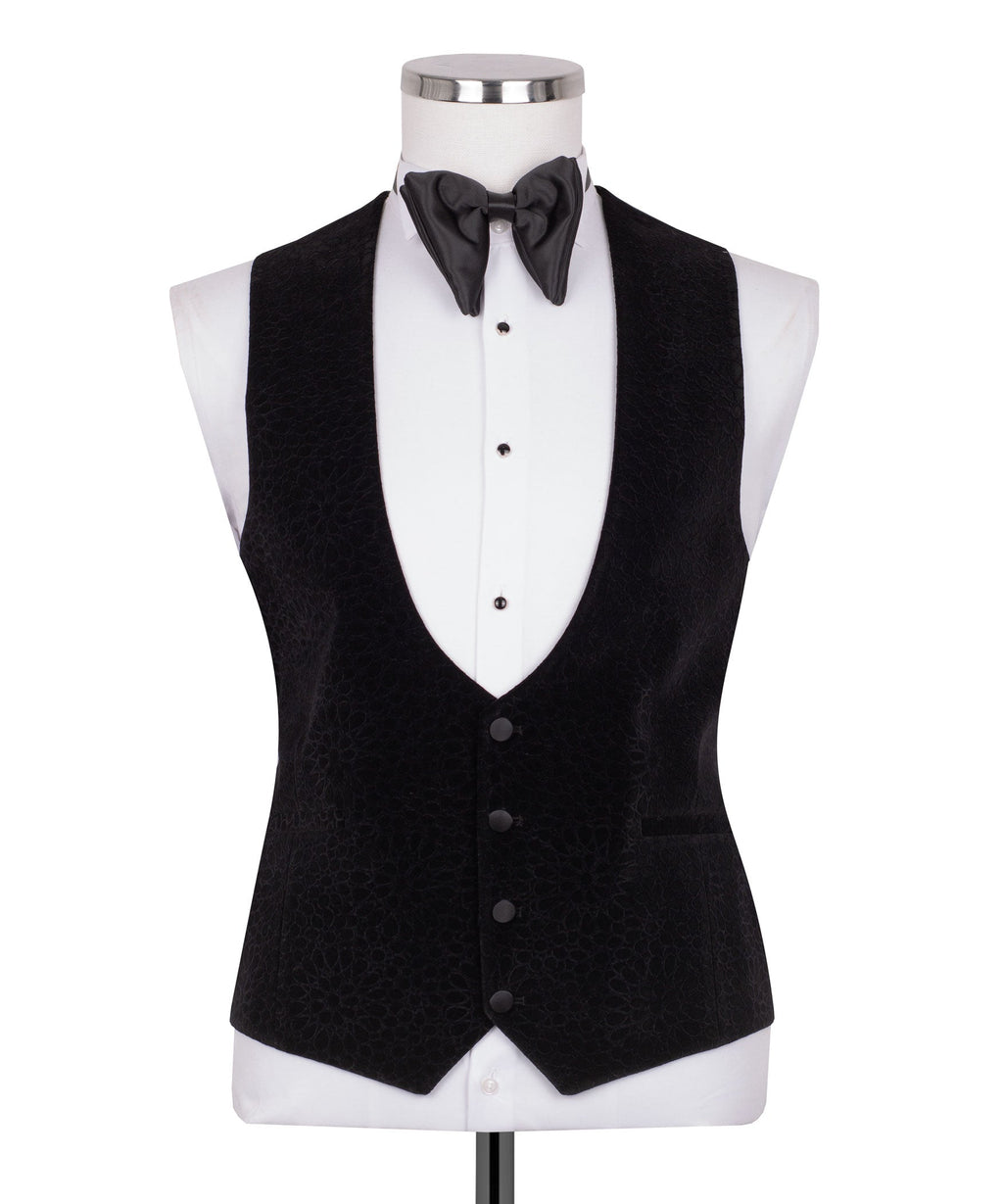Black velvet tuxedo vest with shawl lapel detail and satin bow tie