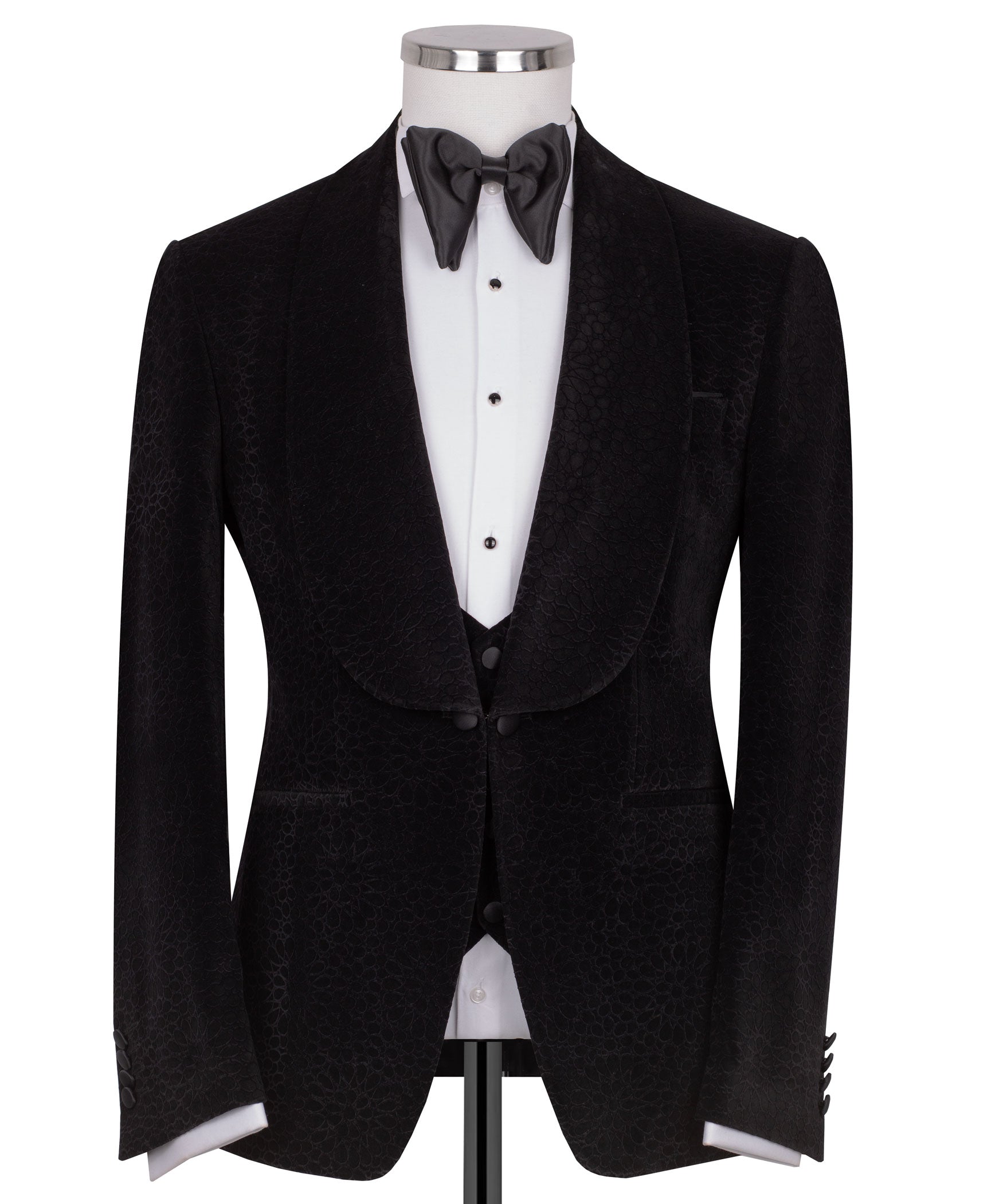 Black velvet tuxedo jacket with shawl lapel and satin bow tie over vest