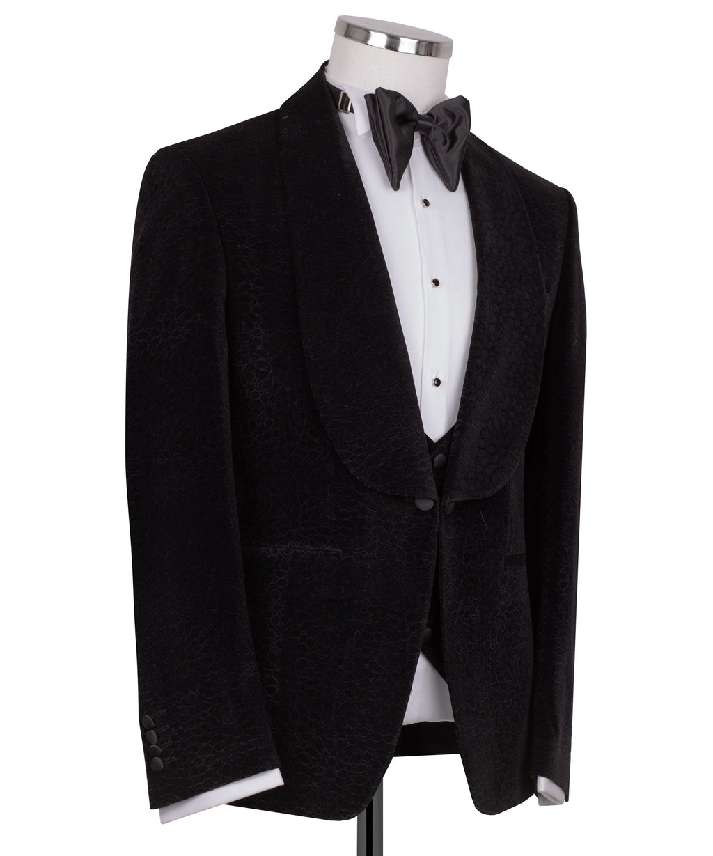 Black velvet tuxedo jacket with shawl lapels and satin bow tie, three-piece look