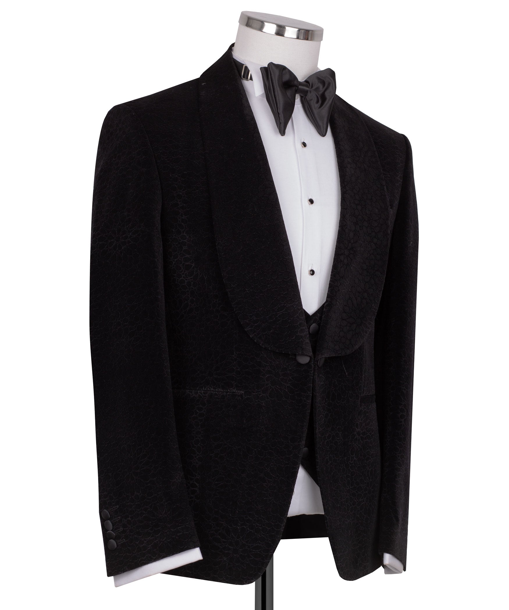 Black velvet tuxedo jacket with shawl lapels and satin bow tie, three-piece look