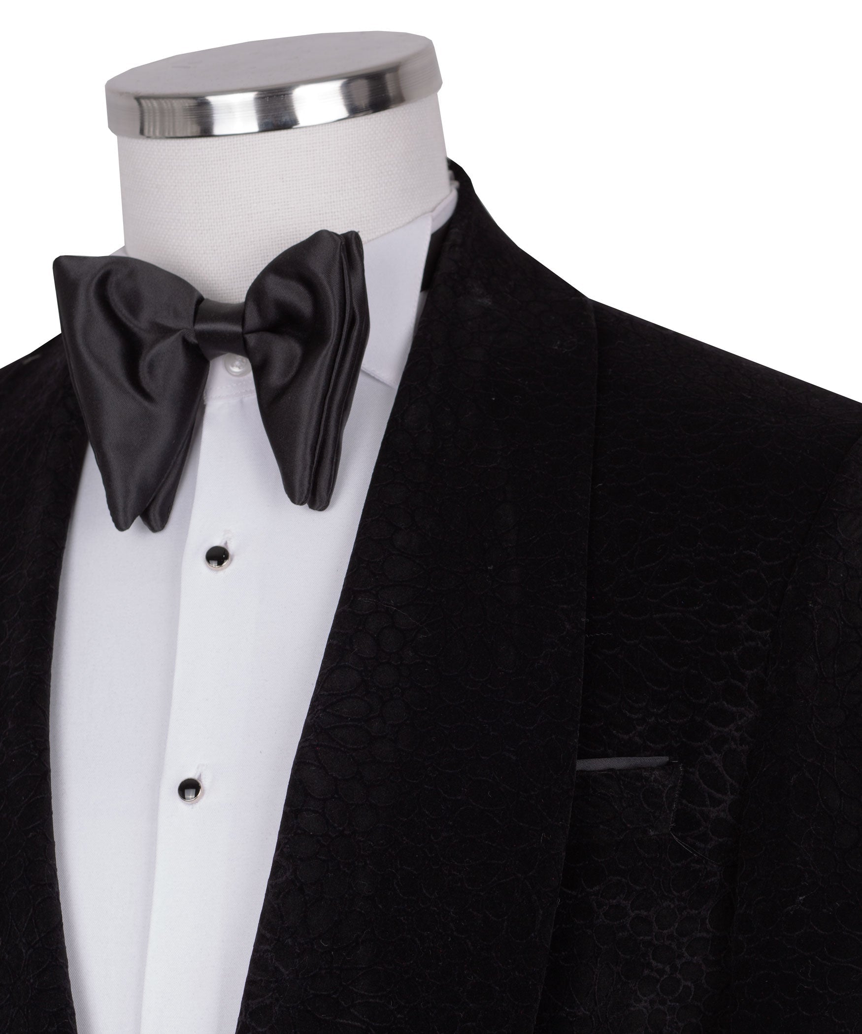 Close-up: black velvet tuxedo jacket with satin bow tie and shirt front