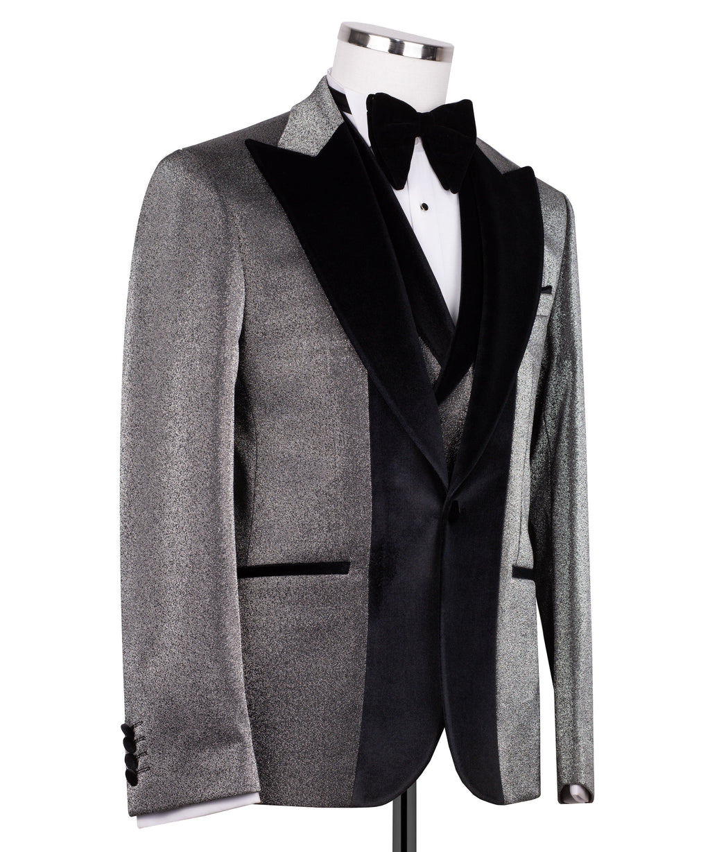 Black tuxedo jacket with velvet collar, satin lapels, and bow tie