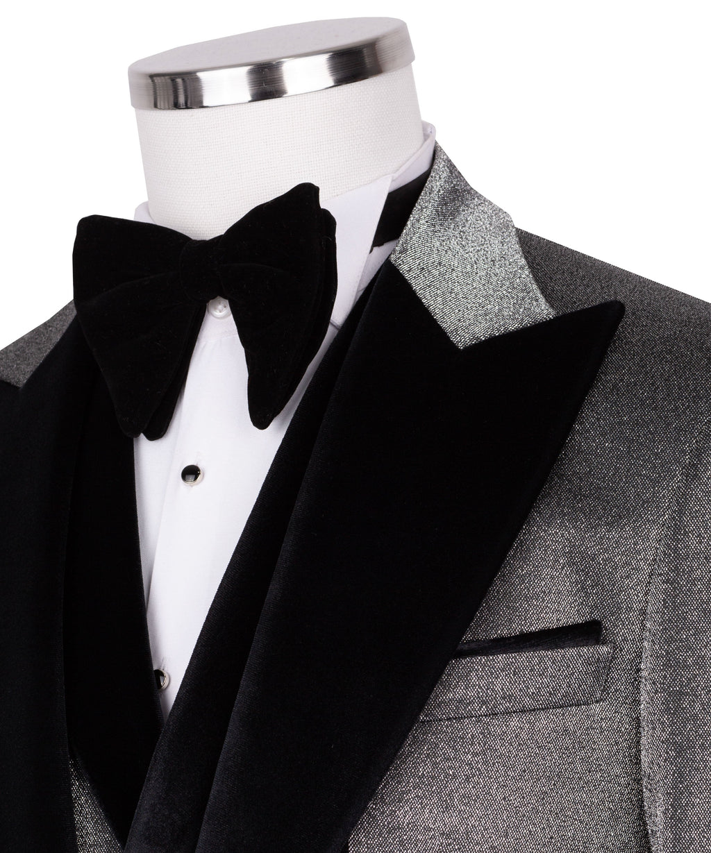 Close-up: black velvet bow tie and satin lapels on tuxedo jacket