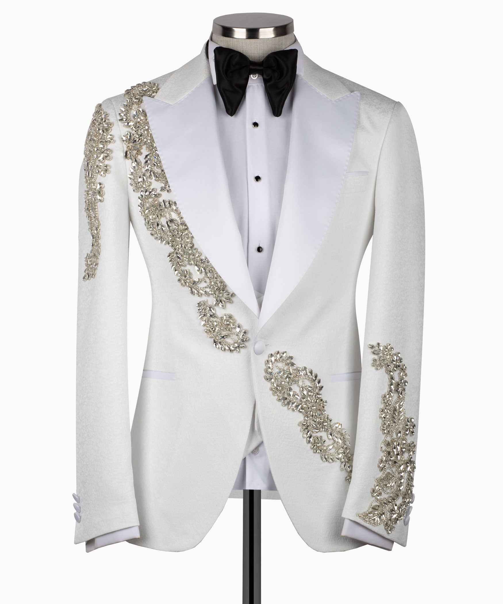 White tuxedo jacket with gold stone embroidery and black bow tie, formal vest included