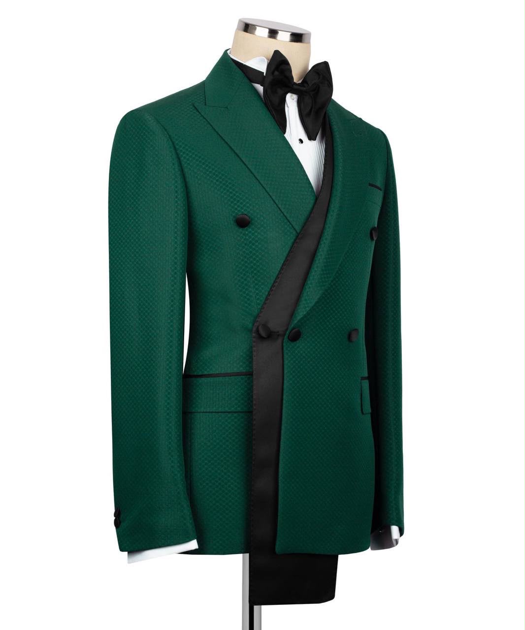 Green tuxedo jacket with black lapels on a mannequin against a white background
