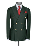 A dark green double-breasted suit jacket displayed on a mannequin torso, styled with a white dress shirt, a red patterned tie, and a matching red pocket square 