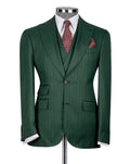 Green suit jacket on a mannequin with a white shirt and patterned tie and pocket square.