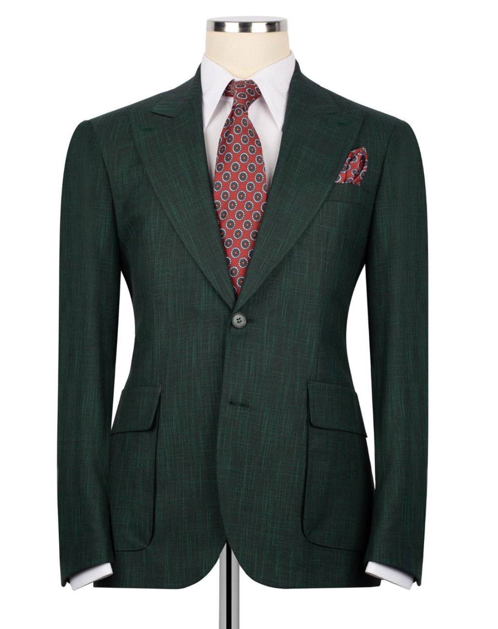 A dark green pinstripe suit jacket displayed on a mannequin torso, styled with a white dress shirt, a red and blue patterned tie, and a matching pocket square against a plain white background.