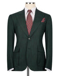 A dark green pinstripe suit jacket displayed on a mannequin torso, styled with a white dress shirt, a red and blue patterned tie, and a matching pocket square against a plain white background.