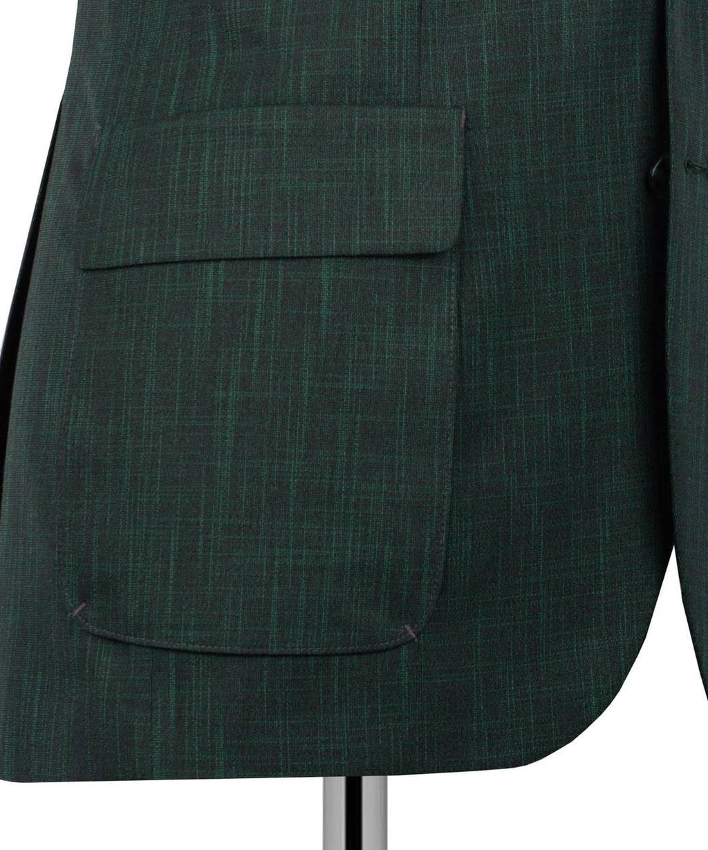 Close-up of a dark green textured blazer jacket with a large flap pocket, displayed on a mannequin against a white background.