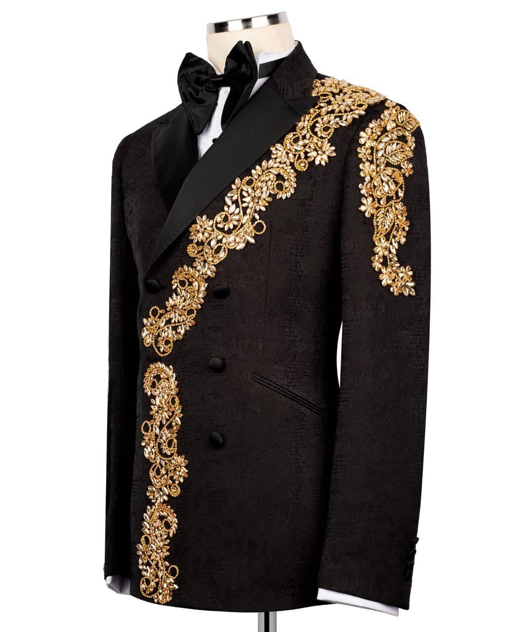 Black tuxedo with gold embroidery on a white background