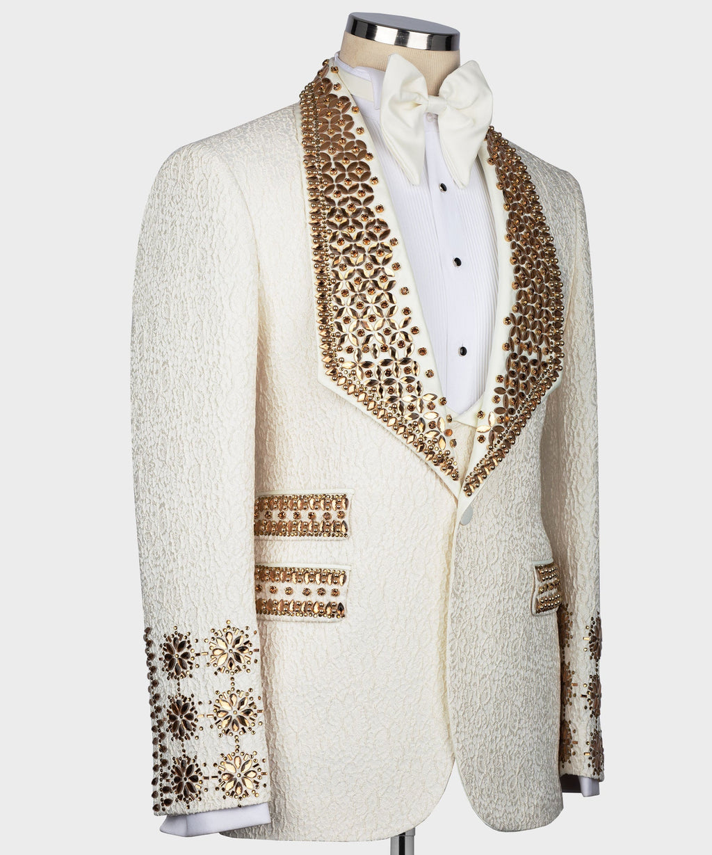 White tuxedo jacket with gold jeweled trim, button placket, and embellished cuffs