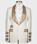 White silk tuxedo jacket with gold jeweled lapels and satin bow tie