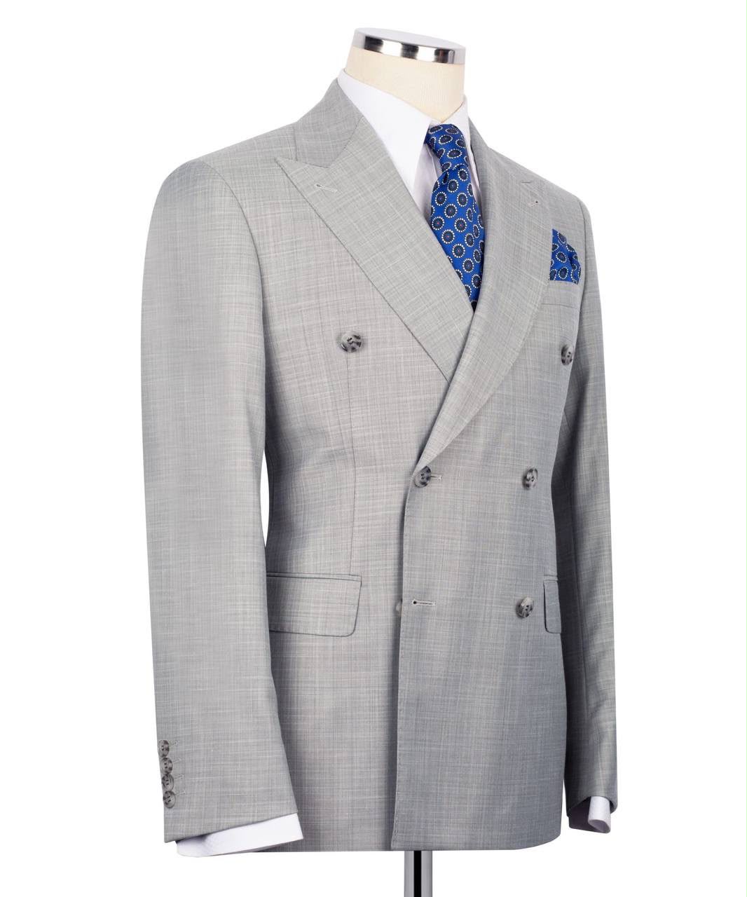 Gray checkered suit jacket on a mannequin with a white background
