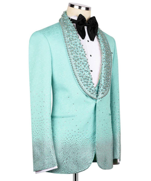 Mint green tuxedo jacket with decorative lapels on a mannequin against a white background