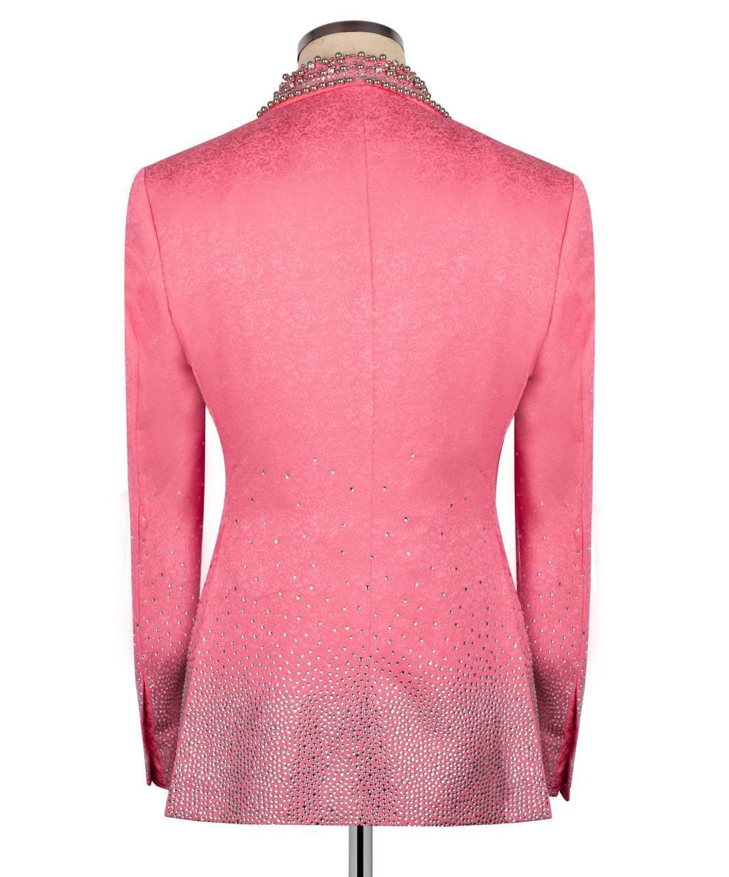 Pink blazer with intricate detailing on a mannequin against a white background