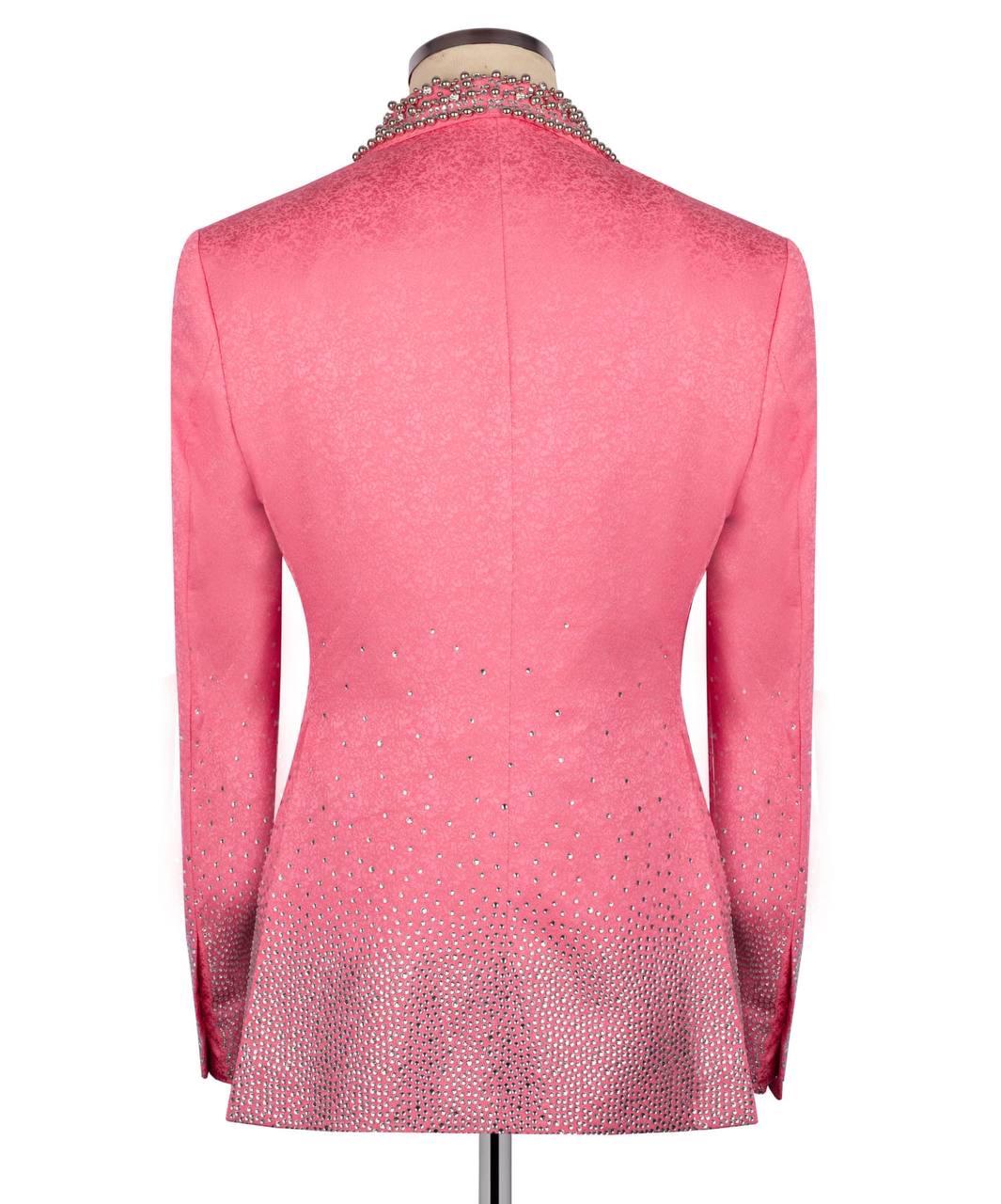 Pink blazer with intricate detailing on a mannequin against a white background