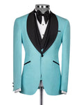 Turquoise tuxedo with black lapels on a mannequin against a white background