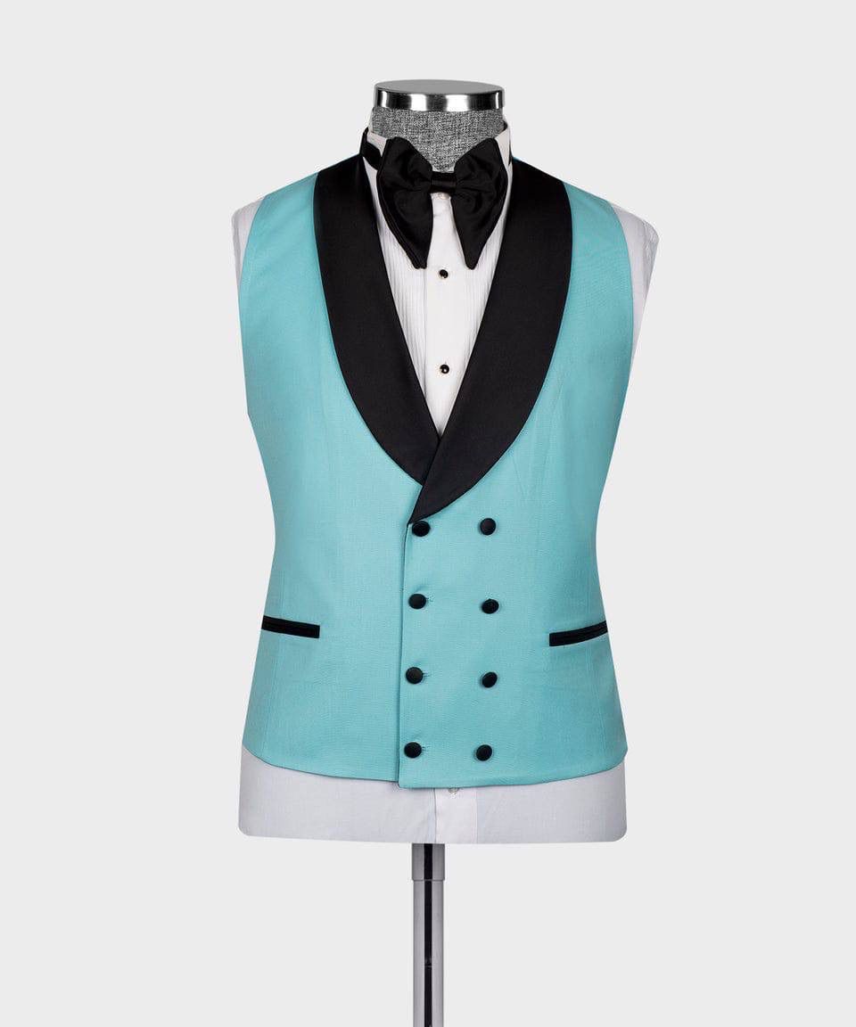 A light turquoise double-breasted tuxedo vest with black satin shawl collar, displayed on a white dress form mannequin with a black bow tie and white shirt.