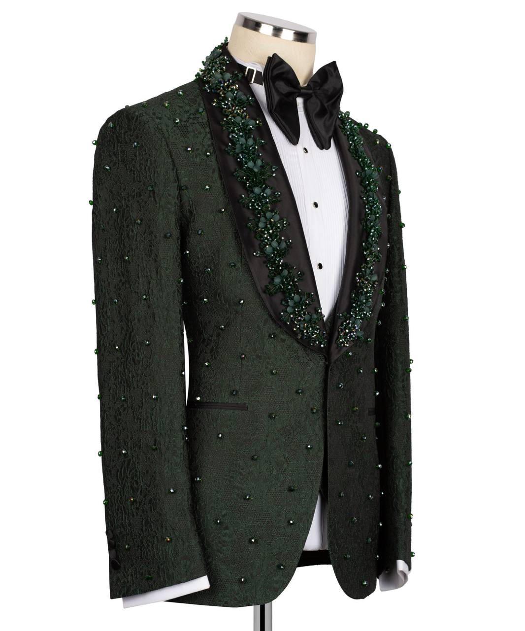 A dark green textured tuxedo jacket with green beaded lapels and matching bead details on the front, displayed on a mannequin with a black bow tie and white shirt.