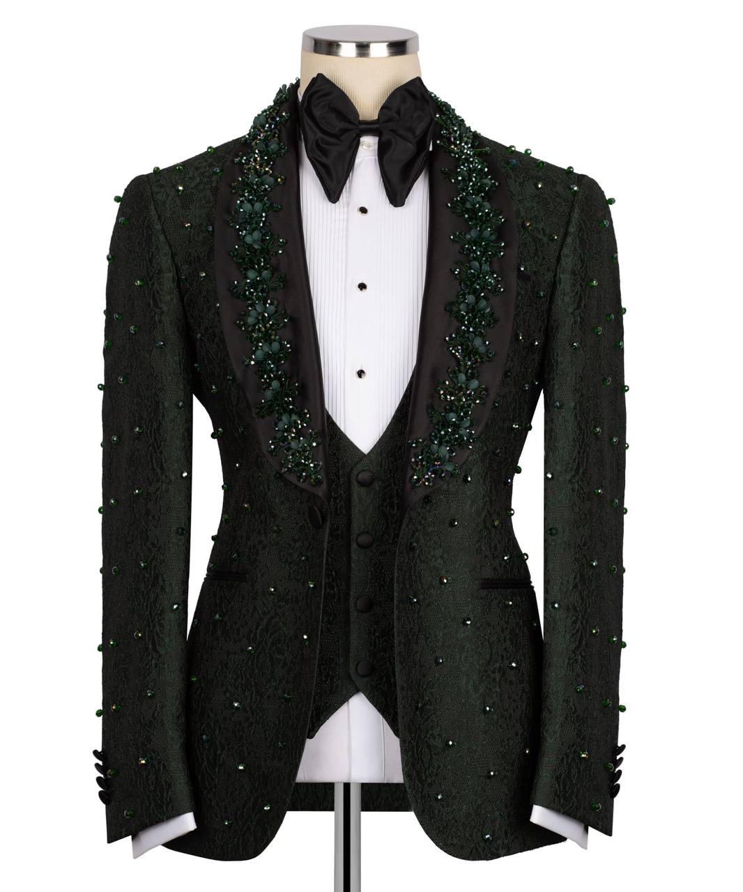 A black tuxedo jacket with green beaded lace trim along the peak lapels and down the sleeves, displayed on a mannequin with a white pinstripe shirt, black bow tie, and matching vest against a white background.