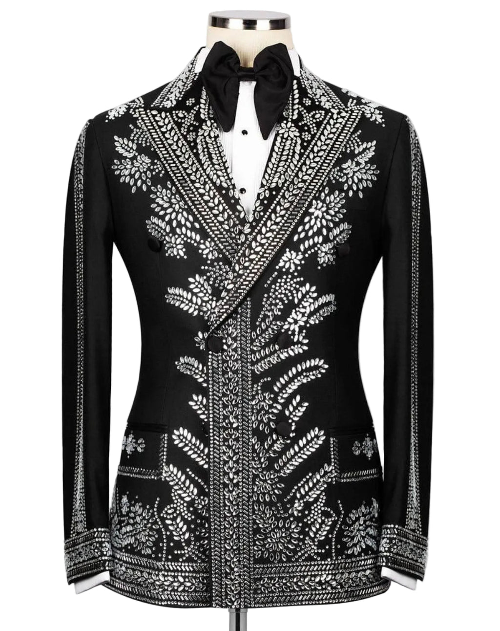 A black tuxedo jacket with intricate silver beadwork and embroidery, styled on a mannequin with a white shirt and black bow tie against a light gray background.
