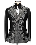 A black tuxedo jacket with intricate silver beadwork and embroidery, styled on a mannequin with a white shirt and black bow tie against a light gray background.