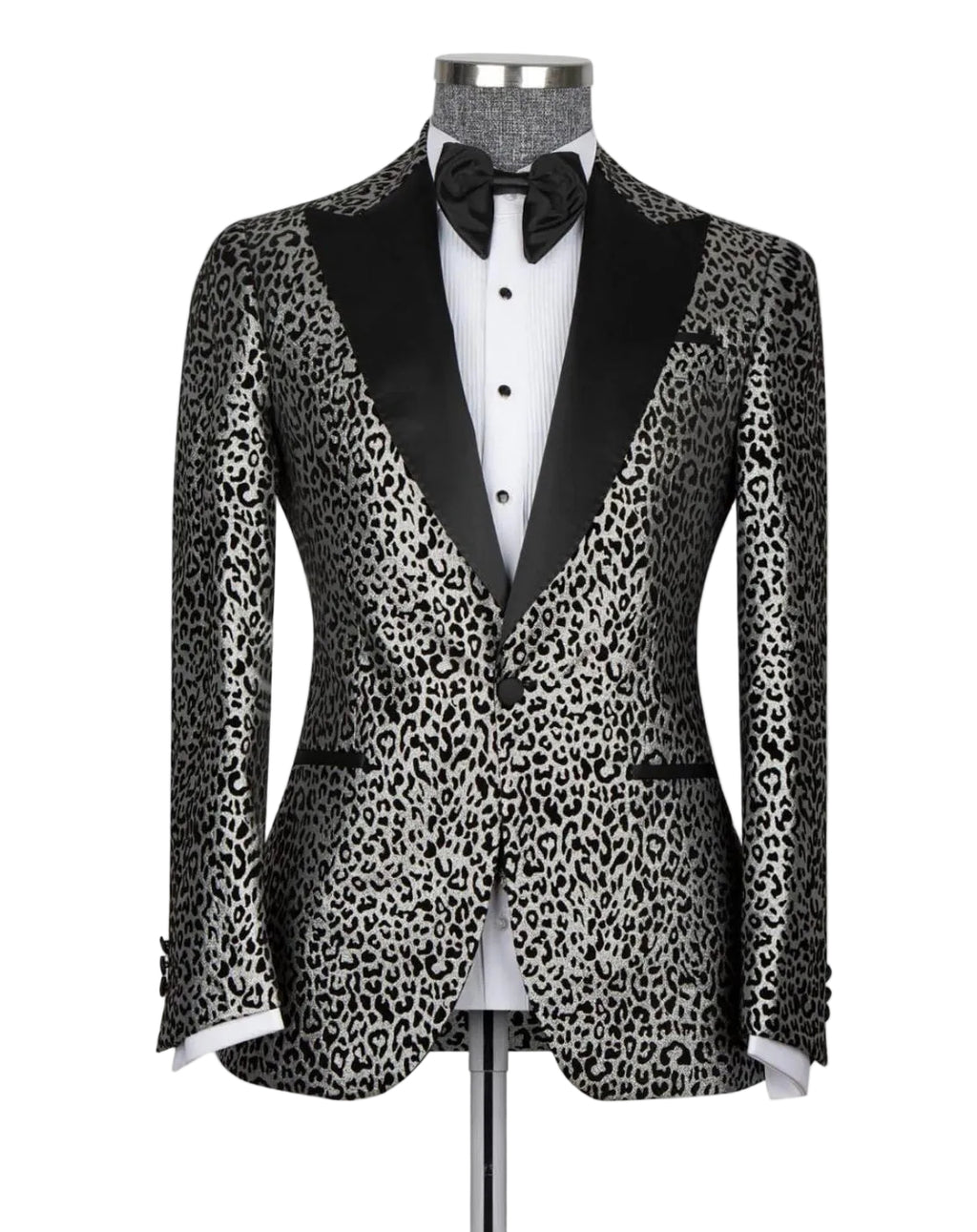 A men's tuxedo jacket with a black and gray leopard print pattern, black satin peak lapels, and a single front button, displayed on a mannequin with a white dress shirt and black bow tie against a light gray background.