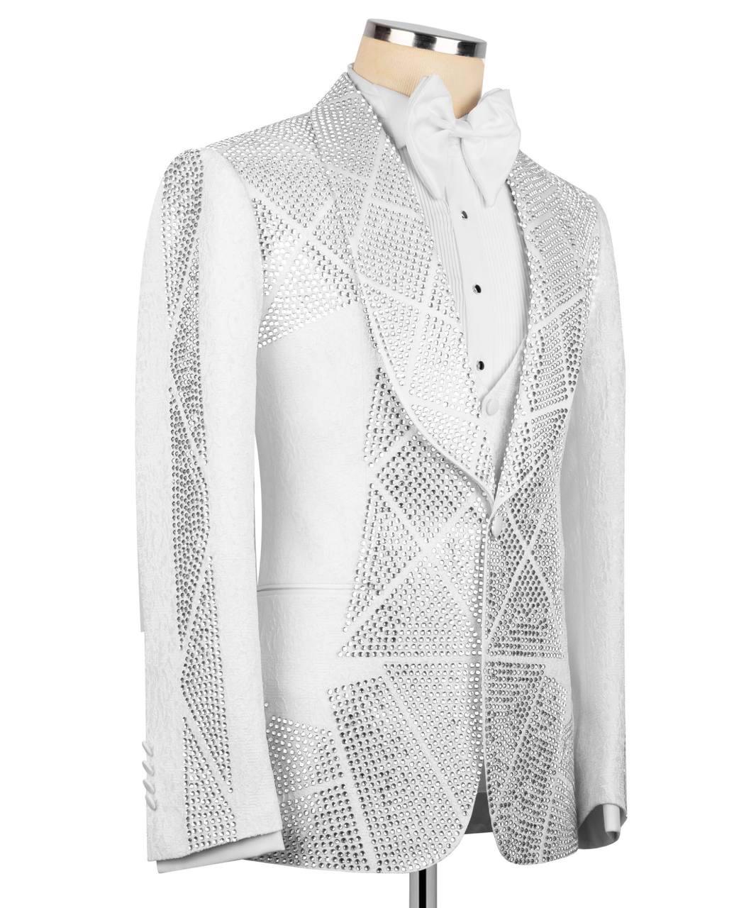 A white formal tuxedo jacket with a geometric, textured geometric pattern of small black dots and lines, styled on a mannequin with a white shirt and bow tie.