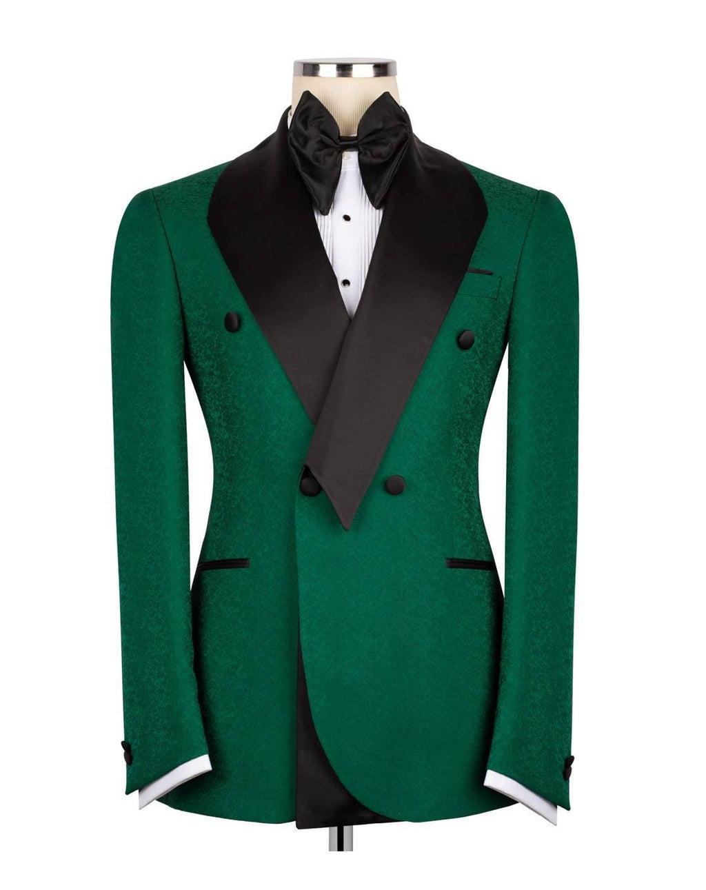 A green double-breasted tuxedo jacket with black satin peak lapels, displayed on a mannequin torso with a black bow tie and white dress shirt against a plain white background.
