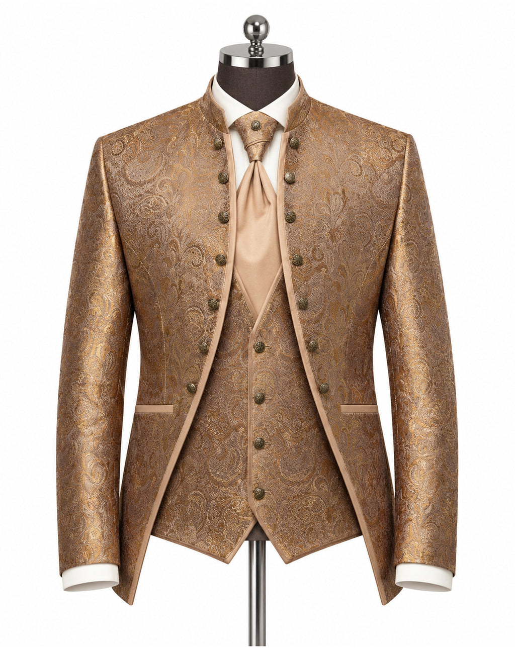 A men's formal three-piece suit displayed on a mannequin, featuring a metallic gold and brown paisley brocade jacket, matching vest, and tie, styled with a white dress shirt and cuffs.