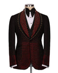 Black and red patterned suit jacket on a mannequin with a white shirt and black bow tie.