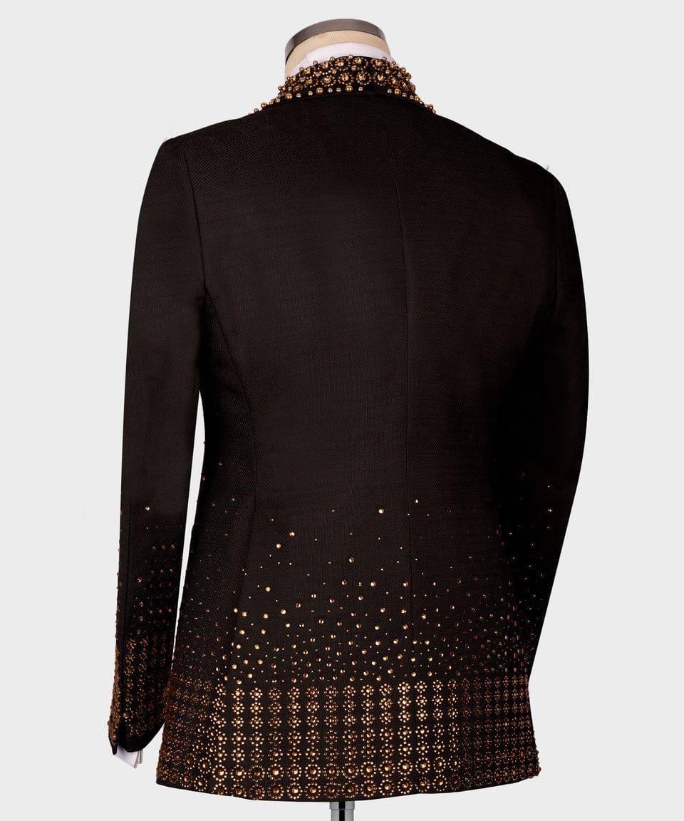 Black blazer with gold patterned hem on a mannequin against a white background