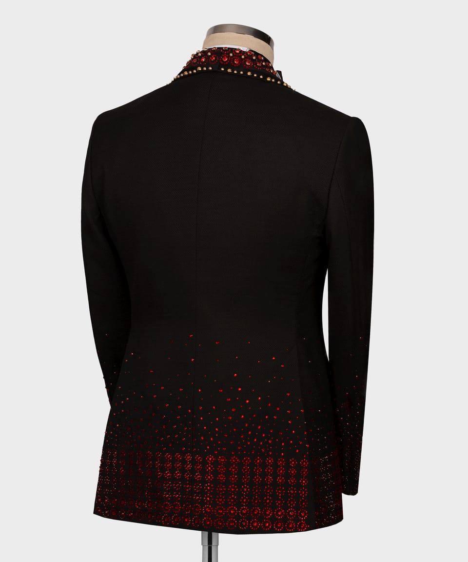 Black jacket with red pattern on a mannequin against a white background