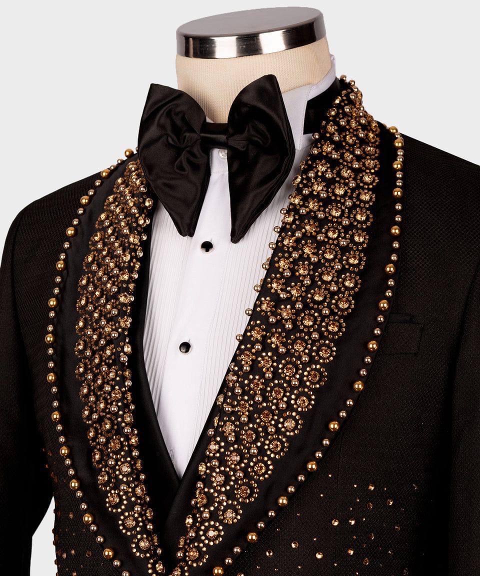 Black tuxedo with gold embellishments on a mannequin against a white background